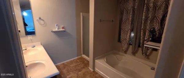 a bathroom with a tub sink and toilet