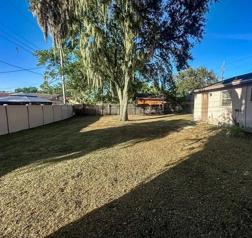 a view of a yard with an outdoor space
