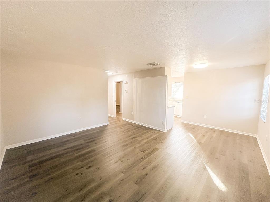 4135 Old Road 37 Lakeland, FL 33813 - Photo 2 of 11 a view of an empty room and wooden floor