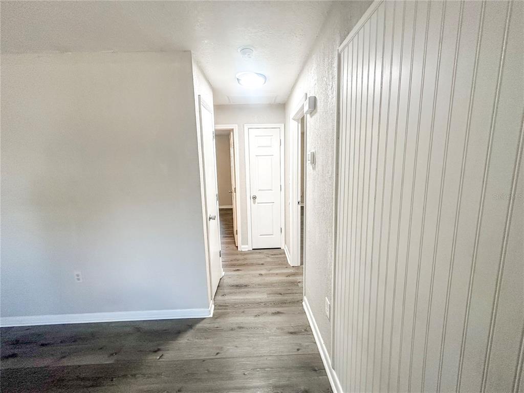 4135 Old Road 37 Lakeland, FL 33813 - Photo 6 of 11 a view of a hallway with wooden floor