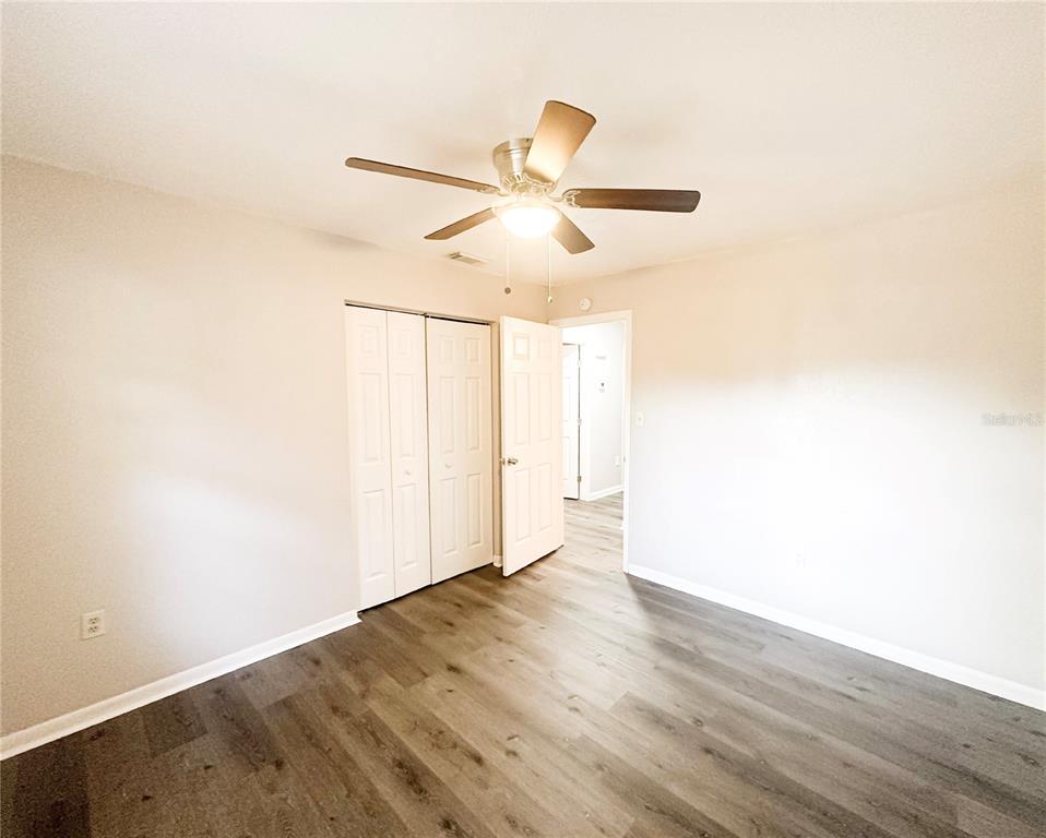4135 Old Road 37 Lakeland, FL 33813 - Photo 8 of 11 a view of an empty room with wooden floor