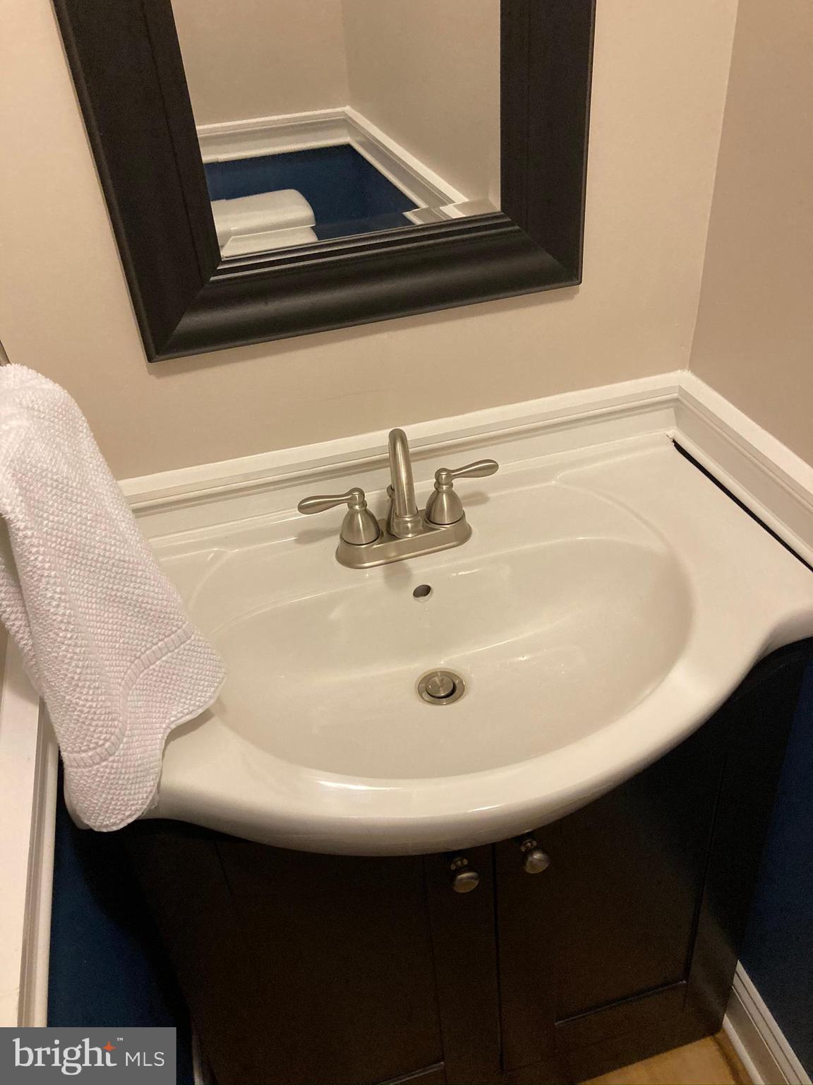 656 Howards Loop Annapolis, MD 21401 - Photo 11 of 59 First Floor Rec Room/Office Half Bath