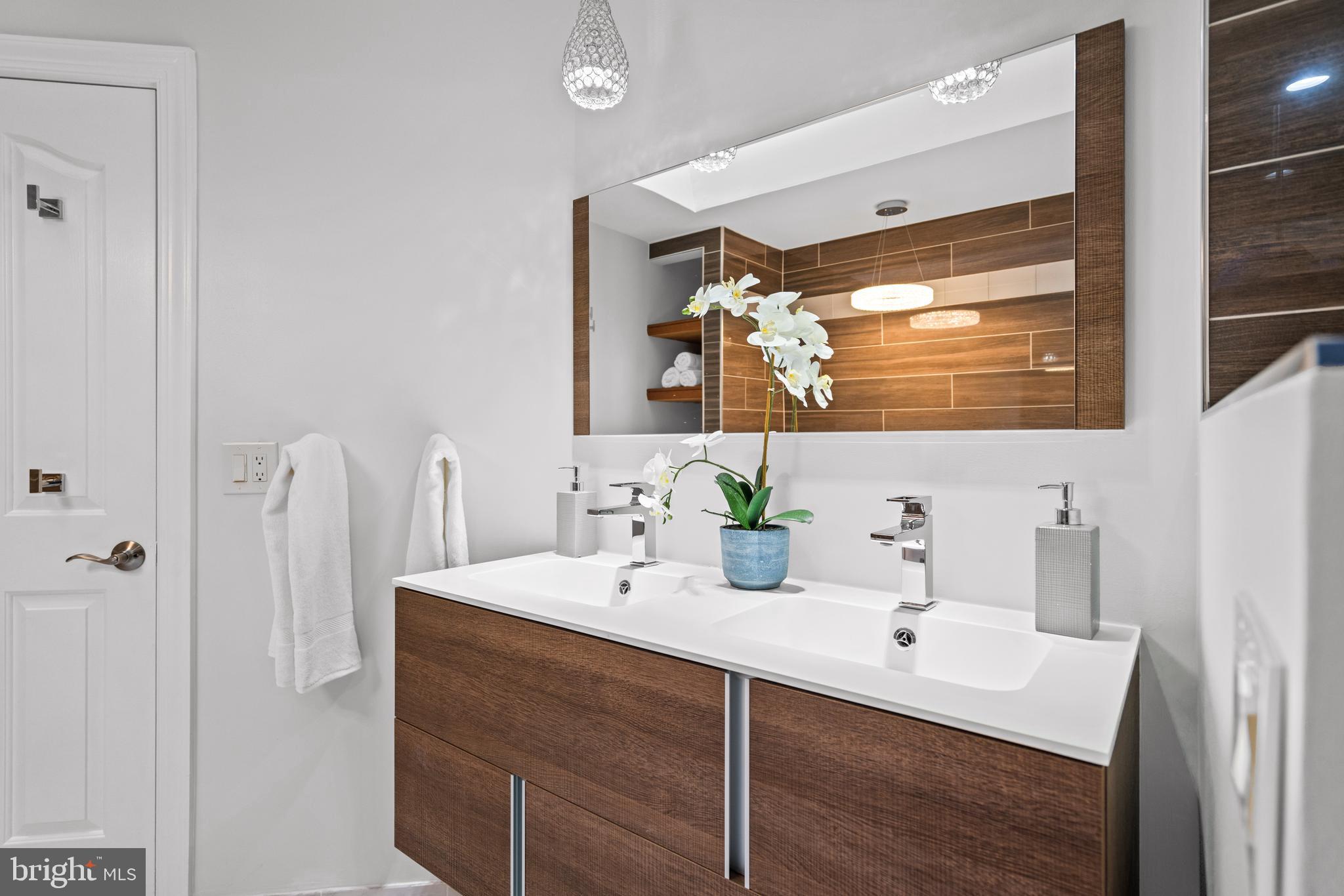 7822 Oracle Place Potomac, MD 20854 - Photo 23 of 45 a bathroom with a sink vanity and a mirror