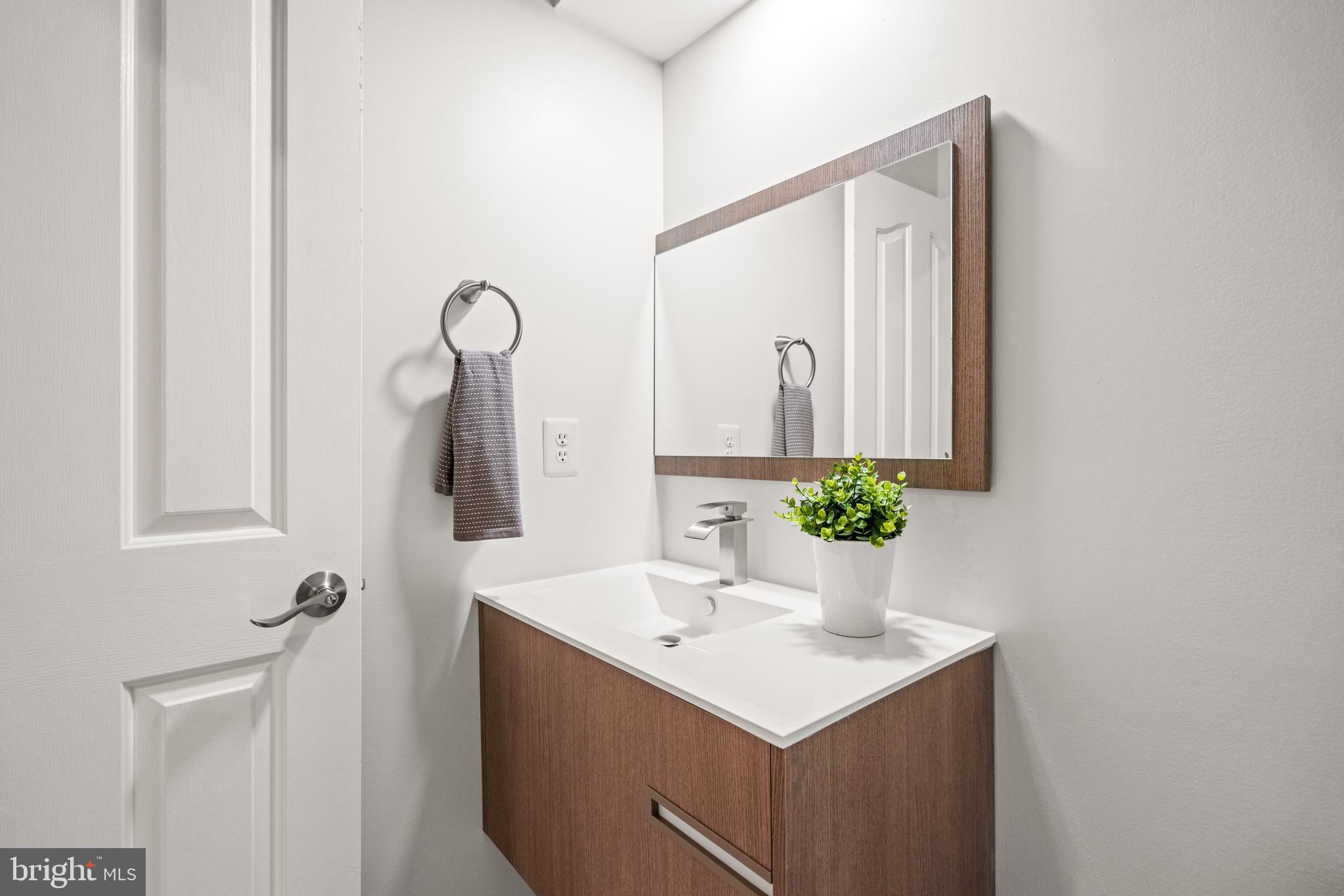 7822 Oracle Place Potomac, MD 20854 - Photo 30 of 45 a bathroom with a sink vanity and a mirror