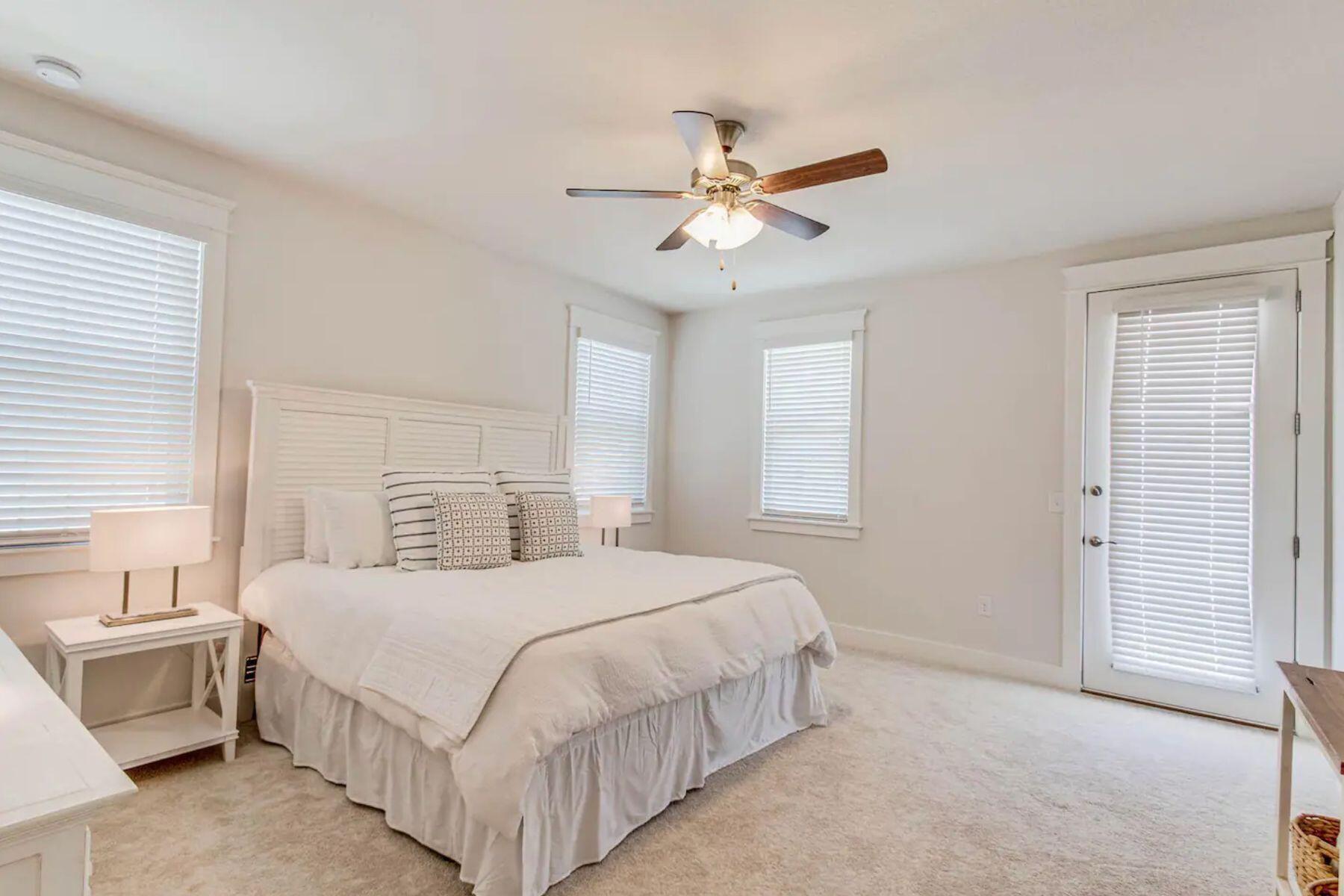 318 Grande Pointe Circle Inlet Beach, FL 32461 - Photo 13 of 30 a bedroom with a bed and a chandelier