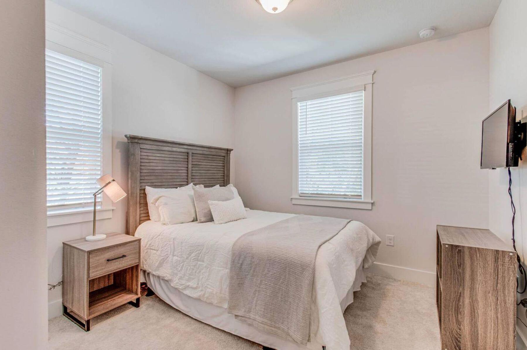 318 Grande Pointe Circle Inlet Beach, FL 32461 - Photo 17 of 30 a bedroom with a bed and a flat screen tv