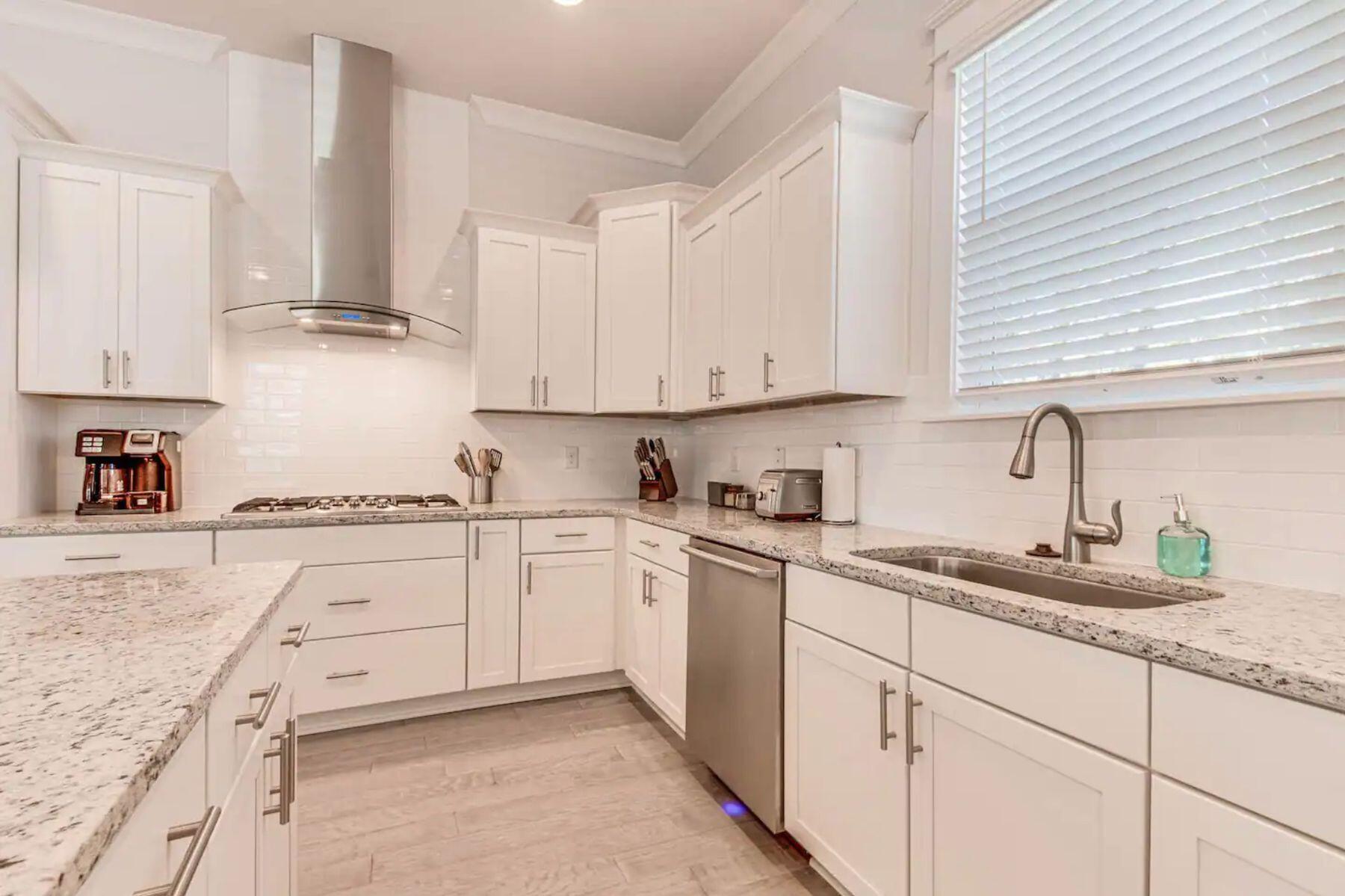 318 Grande Pointe Circle Inlet Beach, FL 32461 - Photo 5 of 30 a kitchen with cabinets appliances a sink and a window