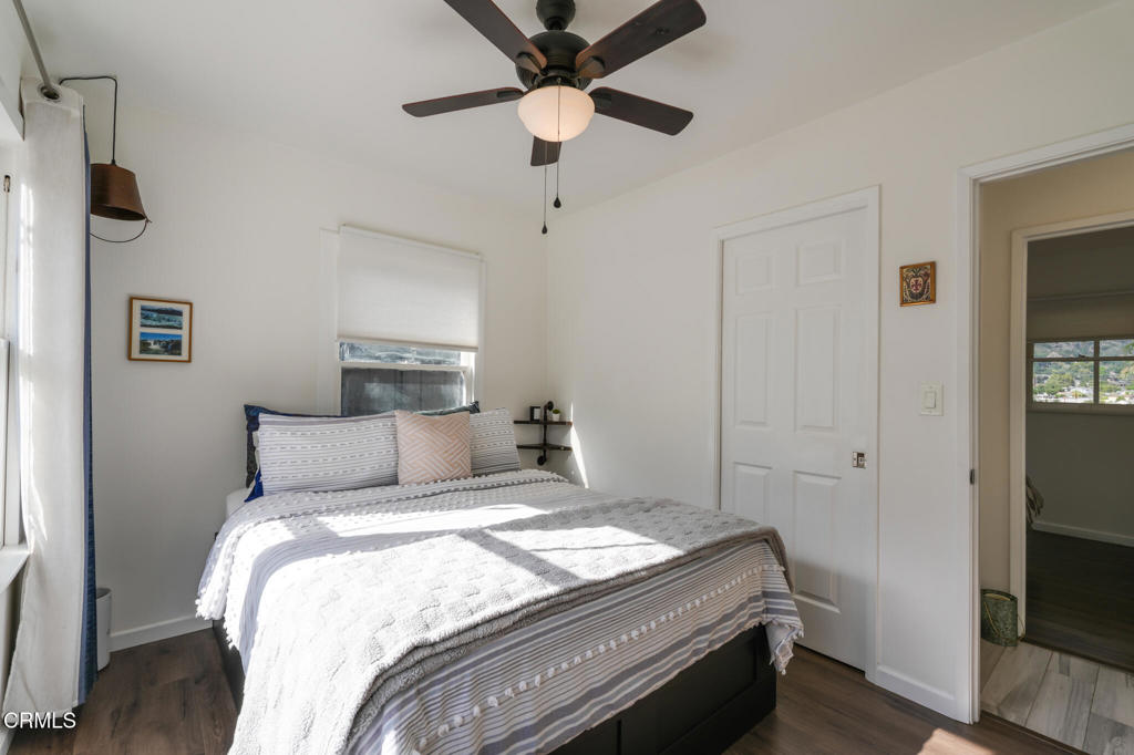 7078 High Cliff Trail Tujunga, CA 91042 - Photo 29 of 47 a bedroom with a bed and a chandelier