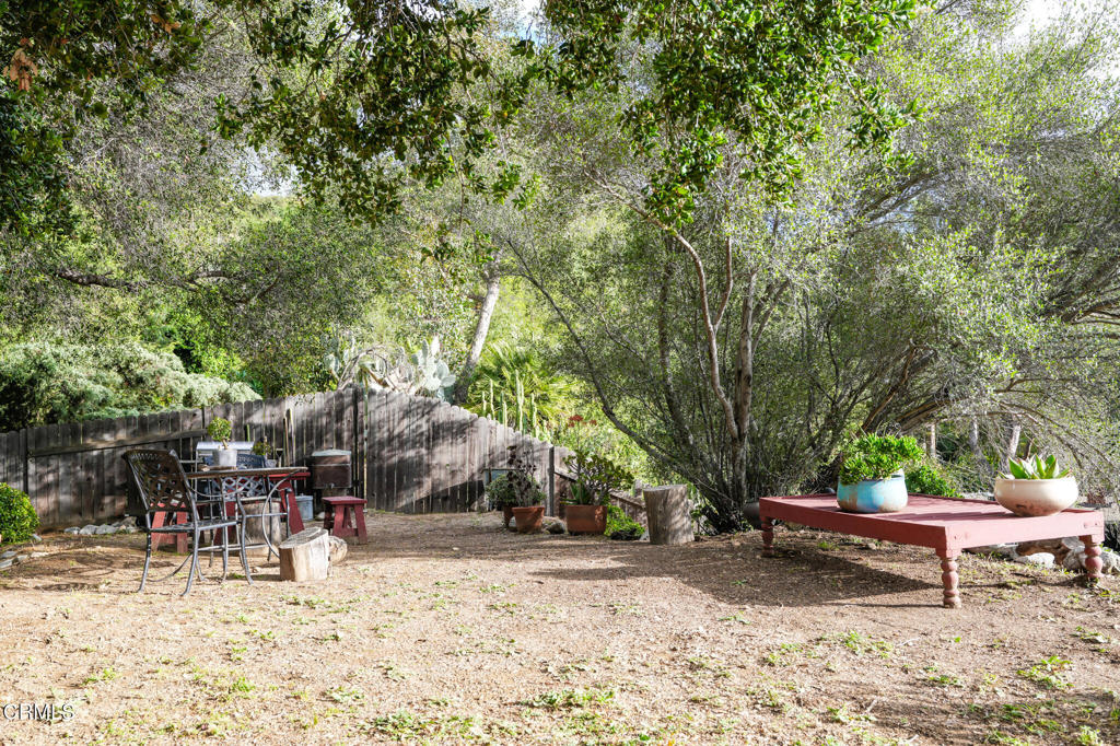 7078 High Cliff Trail Tujunga, CA 91042 - Photo 35 of 47 a backyard of a house with table and chairs