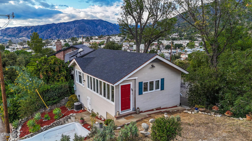 7078 High Cliff Trail Tujunga, CA 91042 - Photo 4 of 47 a view of a house with wooden fence next to a yard