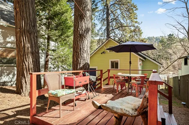 a large bedroom with a bed dresser and a book shelf