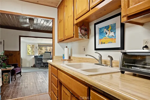 a kitchen with stainless steel appliances granite countertop a refrigerator and a stove