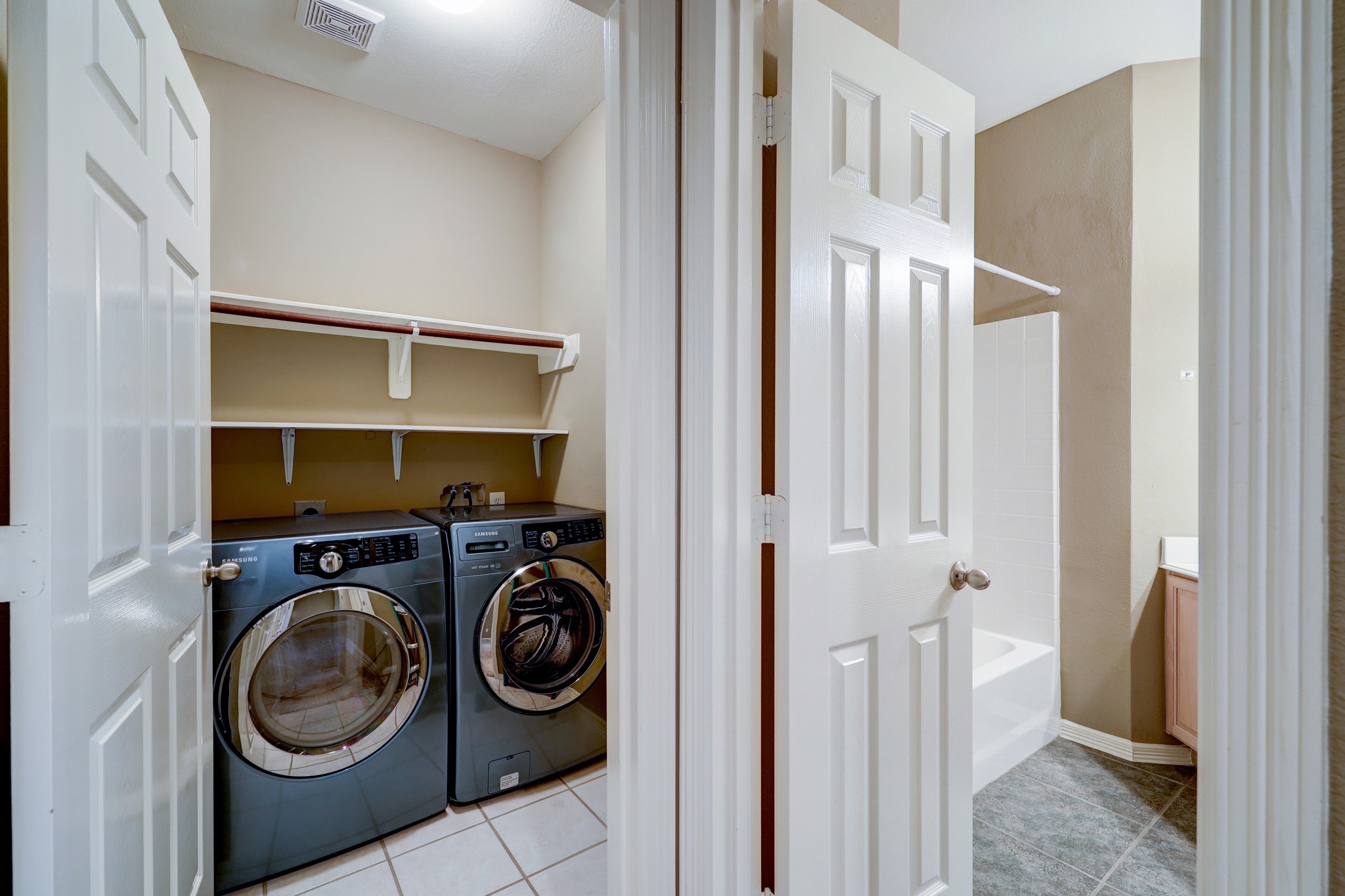 18618 Jaya Loch Court Spring, TX 77379 - Photo 16 of 18 a utility room with dryer and washer