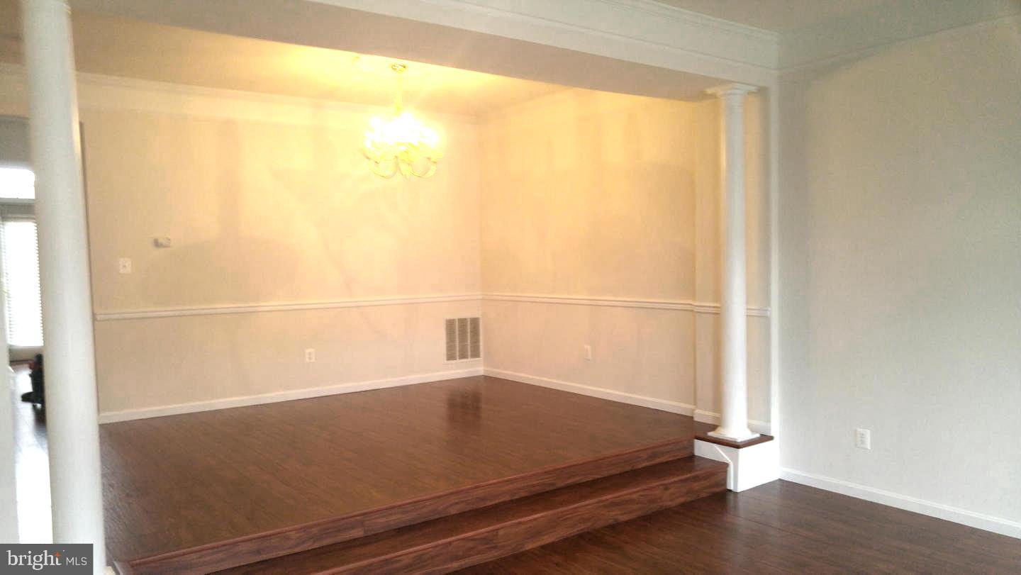 42060 Fremont Preserve Square Aldie, VA 20105 - Photo 16 of 94 a view of a room with wooden floor and windows