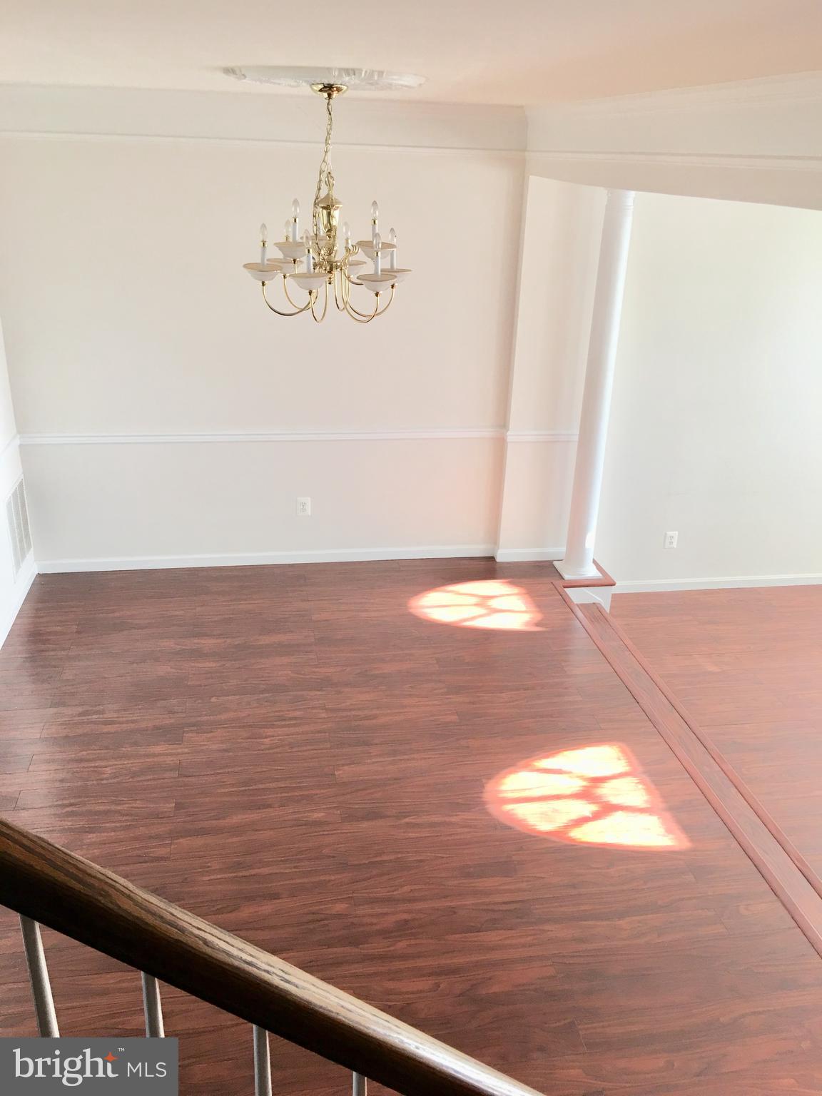 42060 Fremont Preserve Square Aldie, VA 20105 - Photo 17 of 94 a view of wooden floor and chandelier in a room