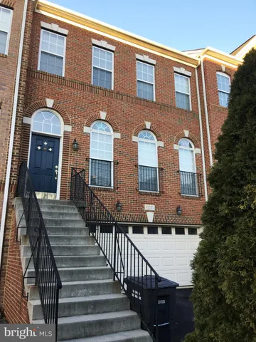 a front view of a house with yard