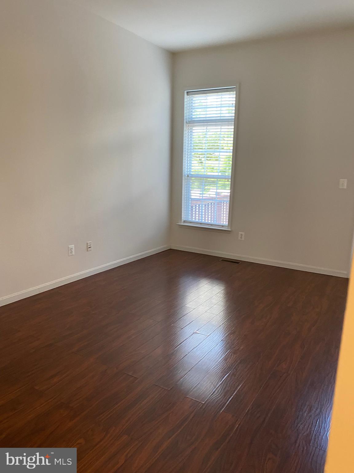 42060 Fremont Preserve Square Aldie, VA 20105 - Photo 23 of 94 an empty room with wooden floor and windows