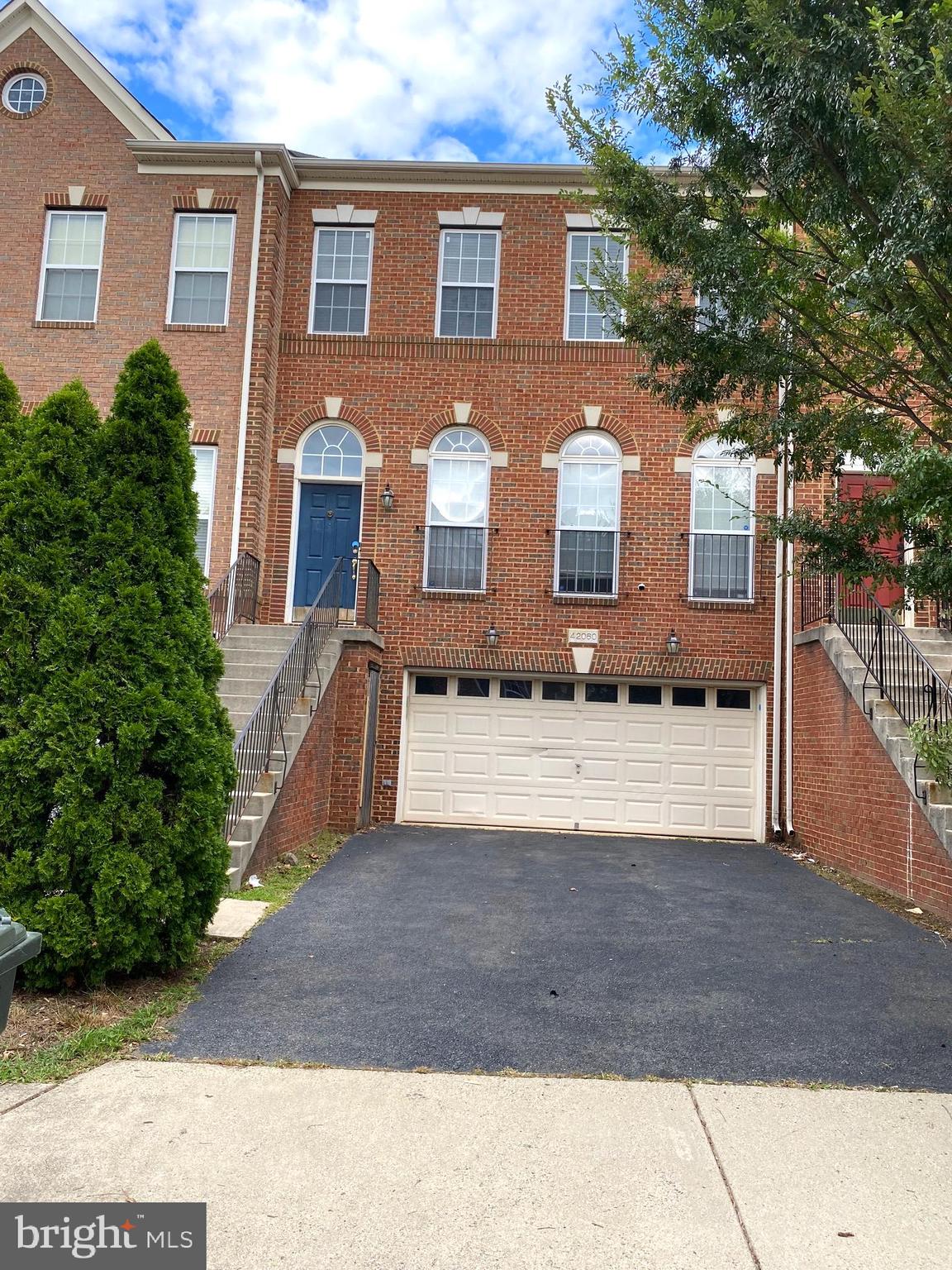 42060 Fremont Preserve Square Aldie, VA 20105 - Photo 3 of 94 a front view of a house with yard