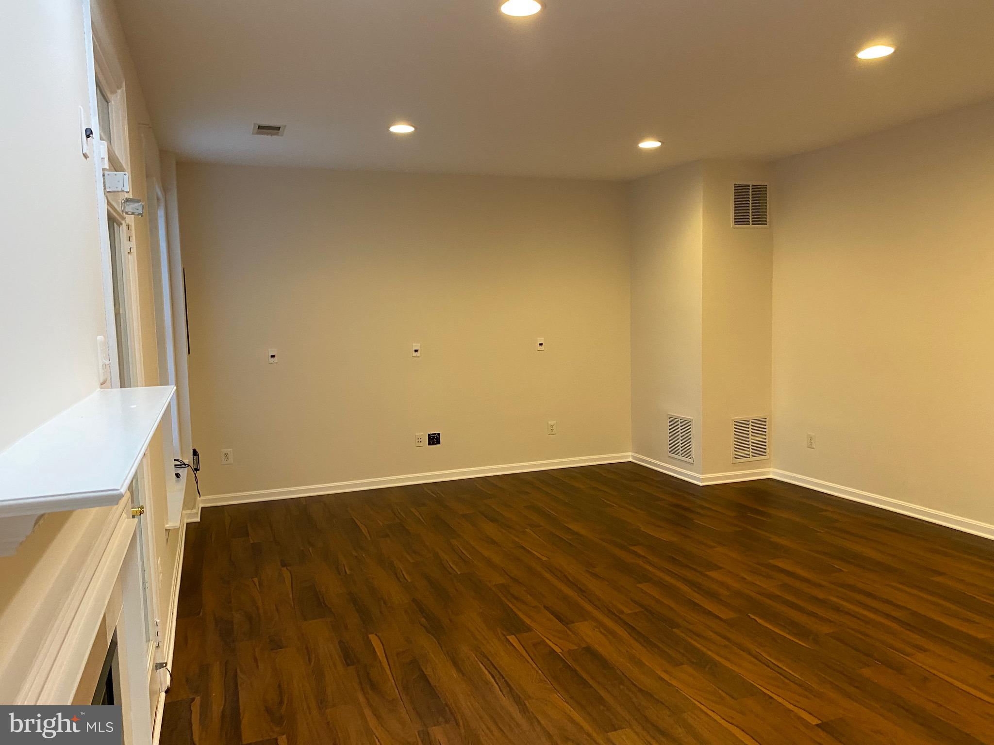 42060 Fremont Preserve Square Aldie, VA 20105 - Photo 65 of 94 a view of empty room with wooden floor and fan