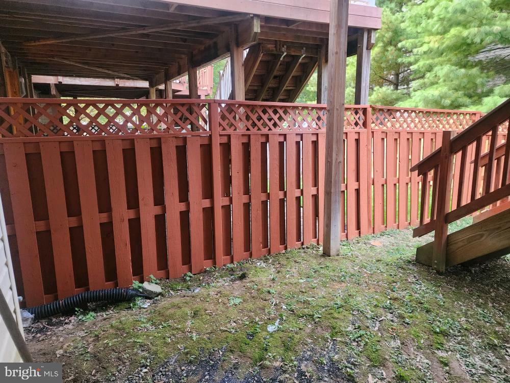 42060 Fremont Preserve Square Aldie, VA 20105 - Photo 72 of 94 a view of a backyard with wooden fence