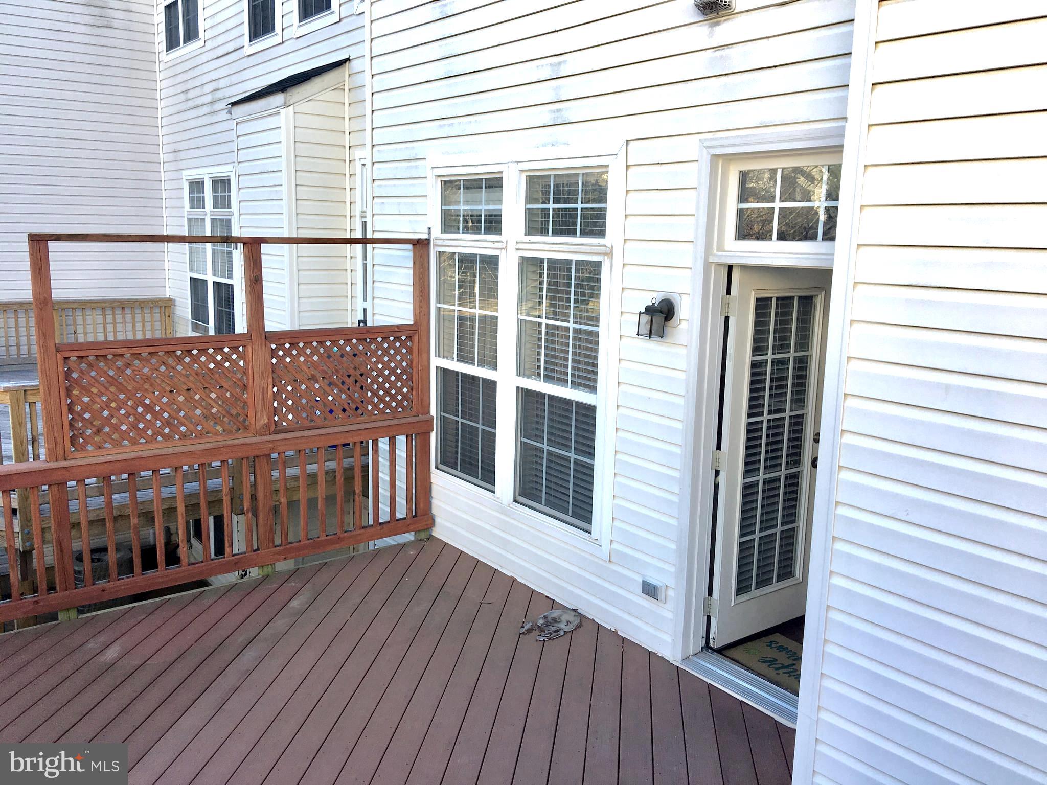 42060 Fremont Preserve Square Aldie, VA 20105 - Photo 78 of 94 a view of a house with wooden deck
