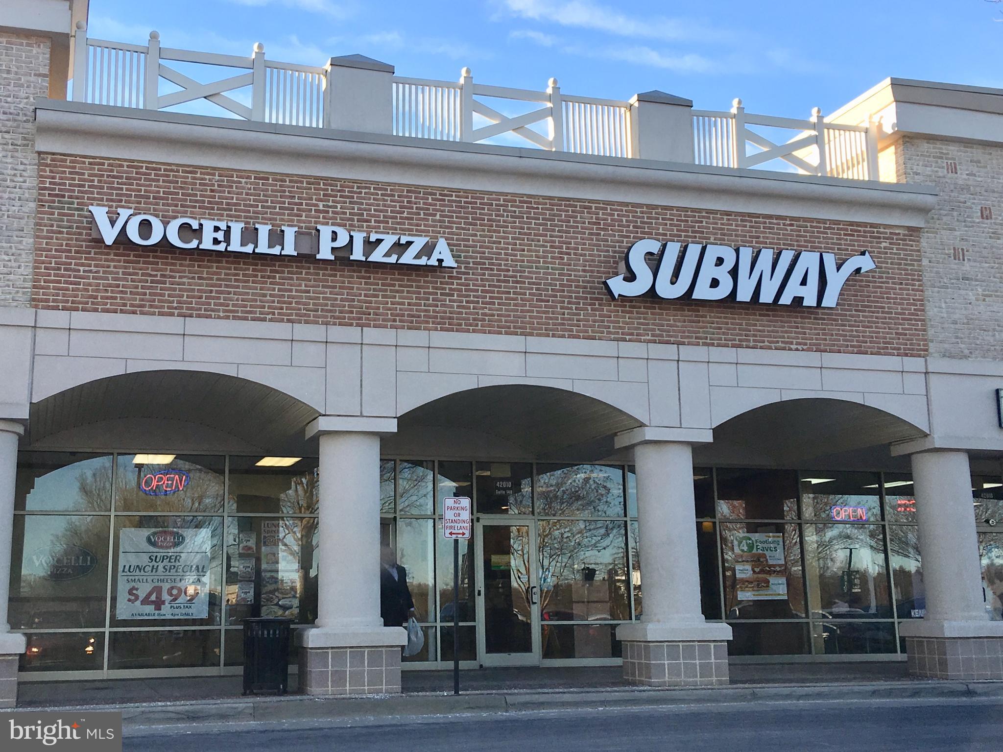 42060 Fremont Preserve Square Aldie, VA 20105 - Photo 93 of 94 a front view of building with retail shop