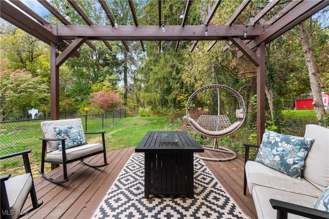 2840 Canton Road Uniontown, OH 44685 - Photo 21 of 25 Wooden terrace featuring an outdoor fire pit