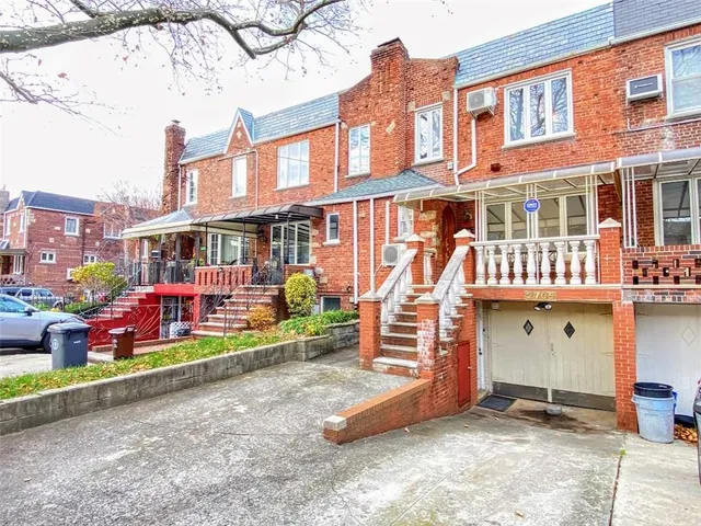front view of a building with a garden