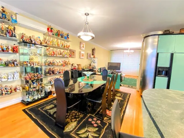 a dining room with furniture and a chandelier