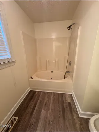 a bathroom with a sink and a bathtub