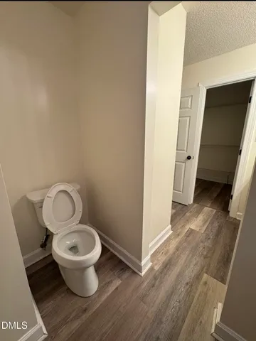 a bathroom with a toilet and a sink