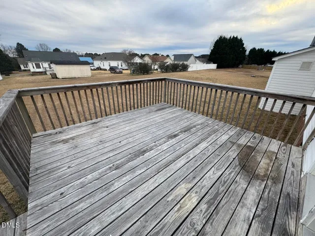 a view of balcony with wooden floor and city view