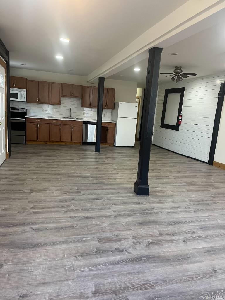 1027 Beekman Road, Unit 1A Hopewell Junction, NY 12533 - Photo 7 of 7 a view of a living room with furniture and a flat screen tv