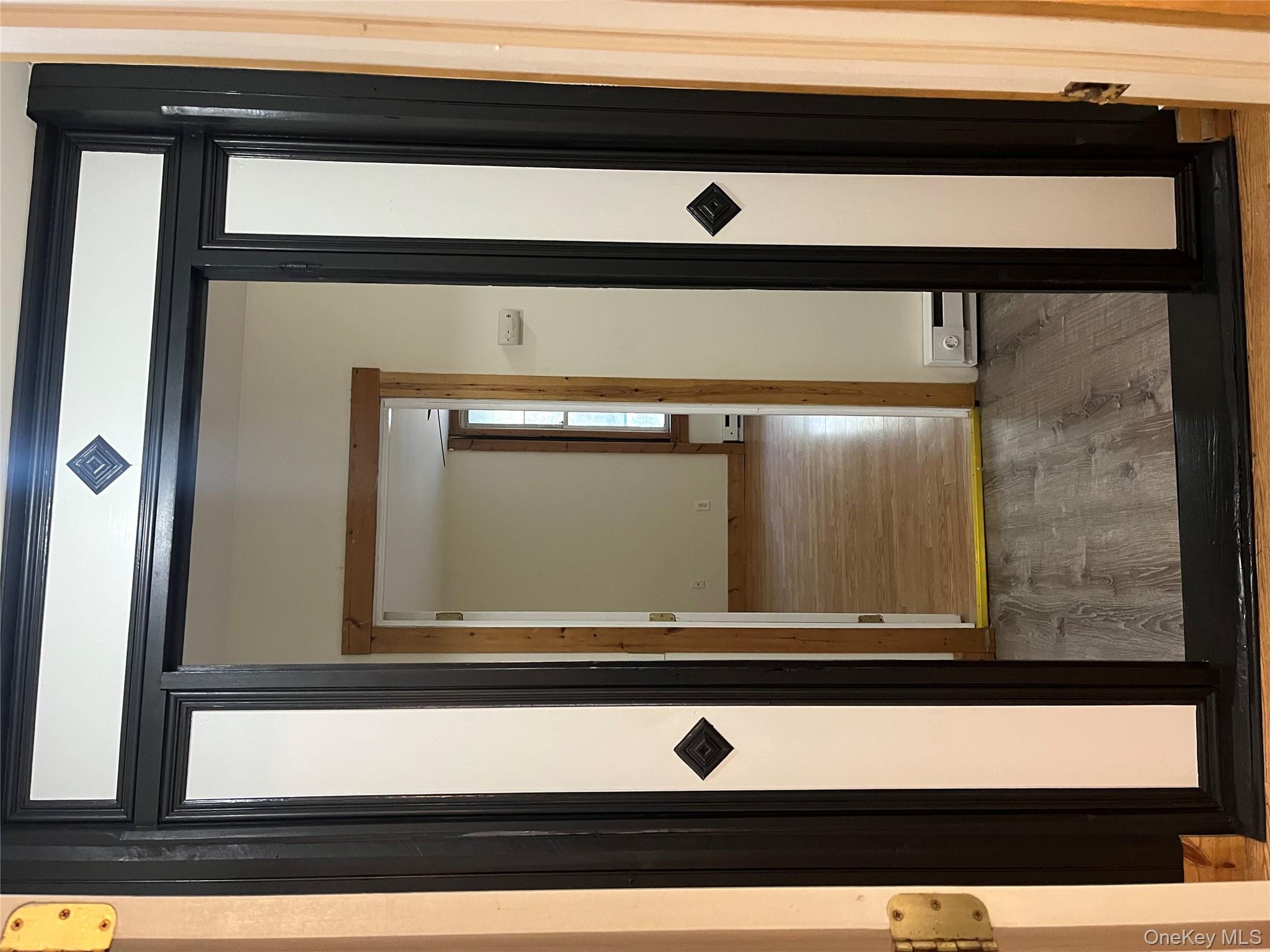 1027 Beekman Road, Unit 1A Hopewell Junction, NY 12533 - Photo 4 of 7 a view of a hallway with wooden floor