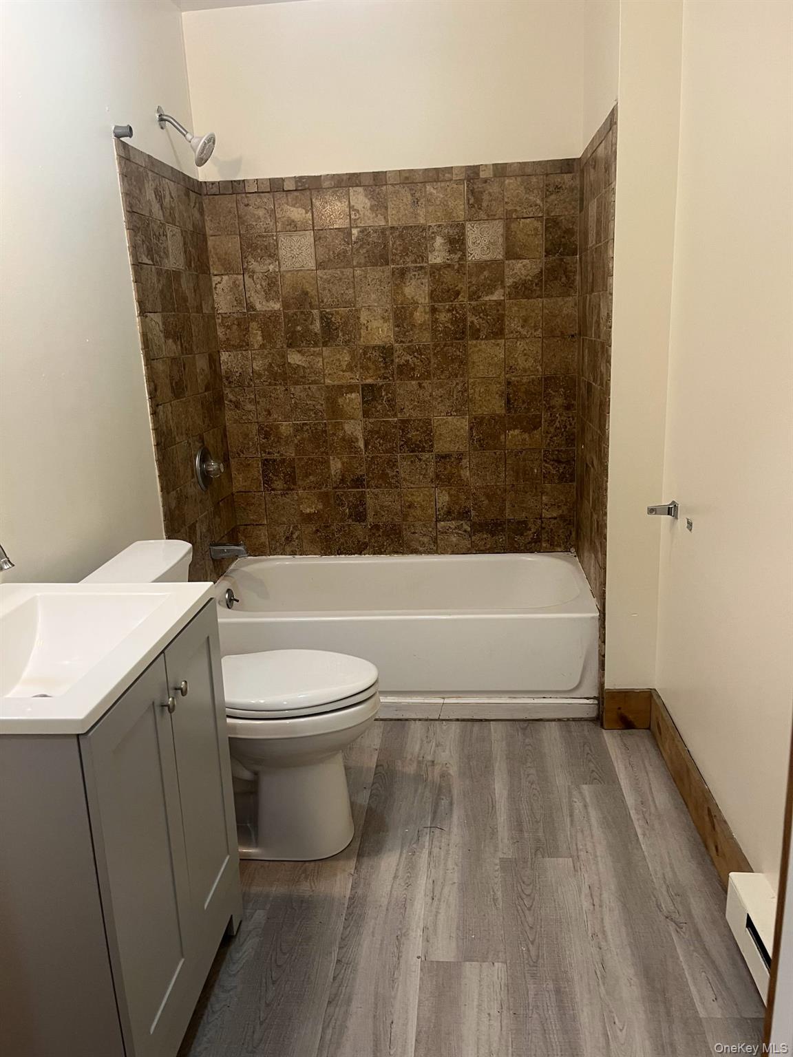 1027 Beekman Road, Unit 1A Hopewell Junction, NY 12533 - Photo 6 of 7 a bathroom with a toilet and a bathtub