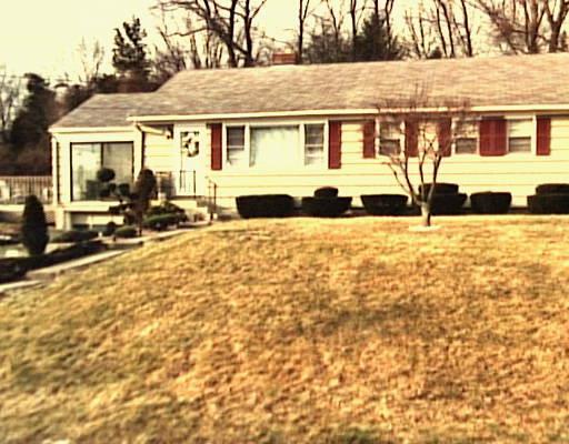 front view of house with a yard