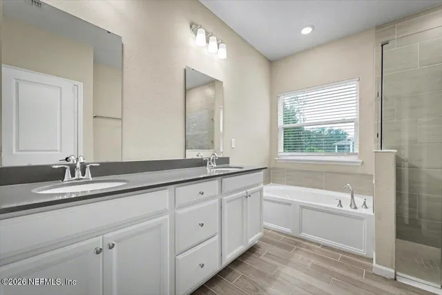 a bathroom with a shower and a bathtub