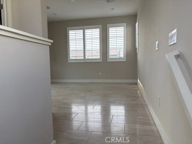 a view of an empty room with a balcony