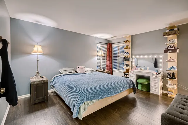 a bedroom with a bed and a fireplace