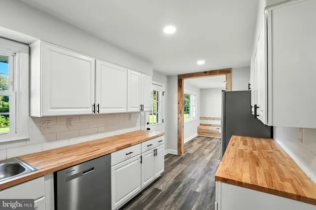 a kitchen with a sink and refrigerator