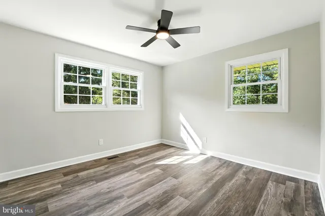 a view of an empty room with stairs