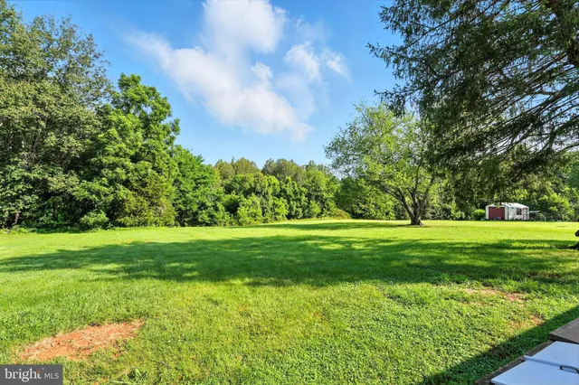 a view of a backyard of a house