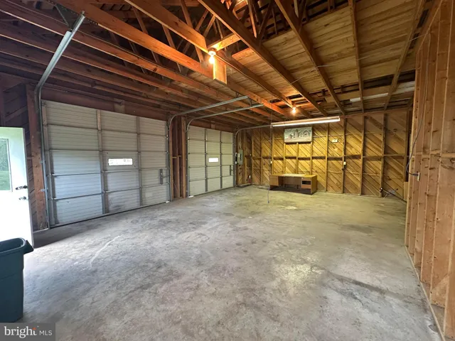 a view of a studio with wooden floor