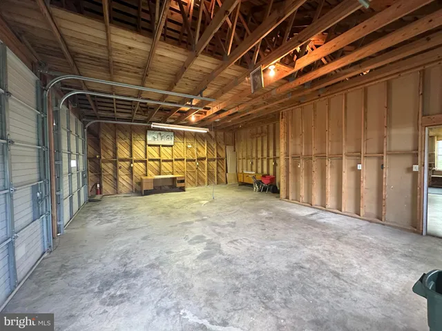 a view of empty room with wooden ceiling