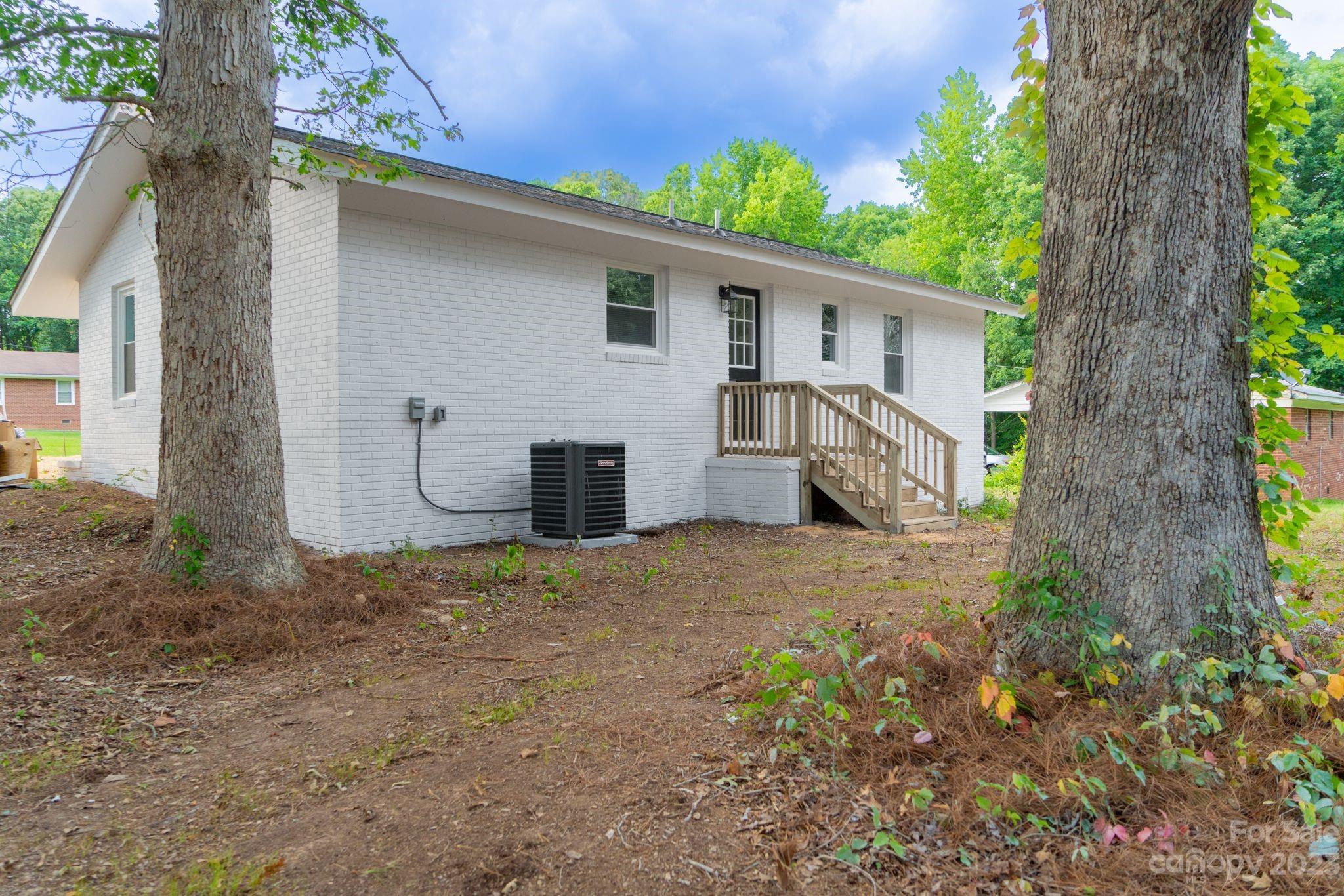 41276 Kings Road New London, NC 28127 - Photo 12 of 12 a view of a house with a tree in the background