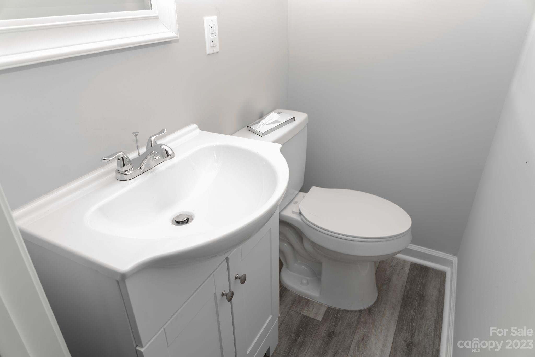 41276 Kings Road New London, NC 28127 - Photo 5 of 12 a white toilet sitting next to a white sink
