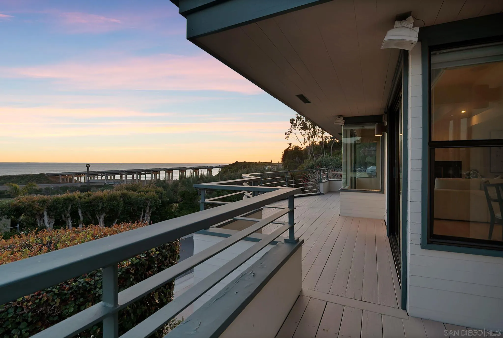 a view of balcony with furniture