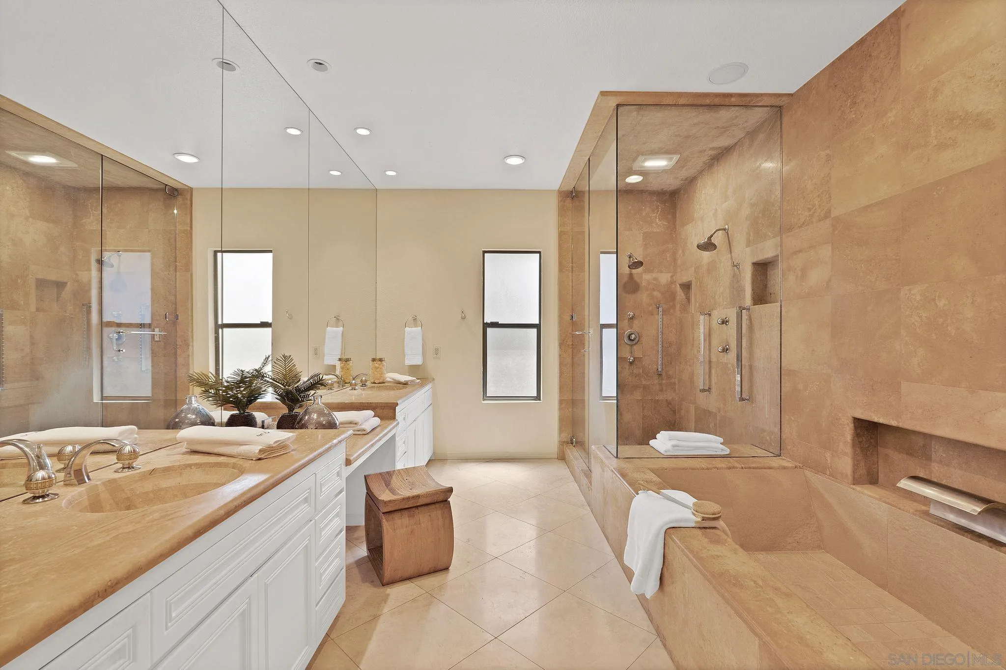 560 Torrey Point Road Del Mar, CA 92014 - Photo 16 of 35 a large spacious bathroom with a double vanity sink a large mirror and a shower