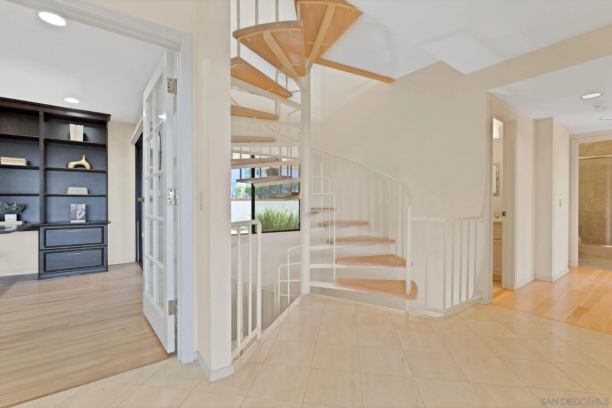 560 Torrey Point Road Del Mar, CA 92014 - Photo 28 of 35 a view of a hallway with wooden floor and staircase