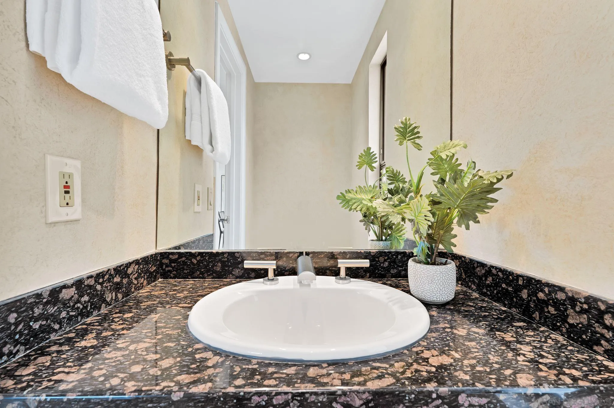 560 Torrey Point Road Del Mar, CA 92014 - Photo 29 of 35 a bathroom with a sink and a mirror